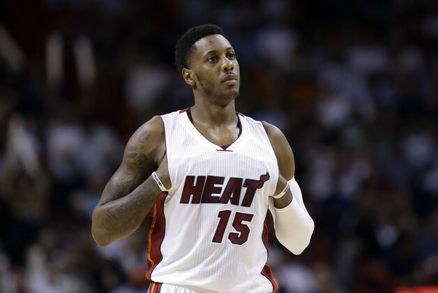 Miami Heat guard Mario Chalmers (15) stands on the court in the second half of an NBA basketball game against the Indiana Pacers, Wednesday, Nov. 12, 2014, in Miami. The Pacers defeated the Heat 81-75. (AP Photo/Lynne Sladky)