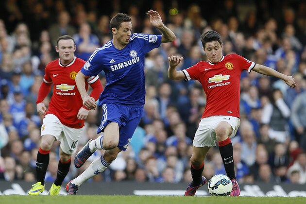 Chelsea's  Nemanja Matic, left, vies for the ball with Manchester United's Ander Herrera during the English Premier League soccer match between Chelsea and Manchester United at Stamford Bridge stadium in London, Saturday, April 18, 2015. (AP Photo/Kirsty Wigglesworth)