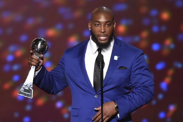 NFL player Devon Still, of the Cincinnati Bengals, accepts the Jimmy V award for perseverance at the ESPY Awards at the Microsoft Theater on Wednesday, July 15, 2015, in Los Angeles. (Photo by Chris Pizzello/Invision/AP)