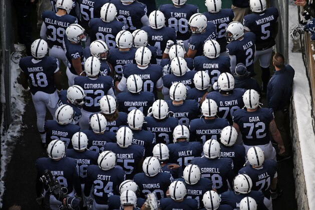 Penn State football played stand in the tunnel waiting to take the field at Beaver Stadium before an NCAA college football game against Michigan State  in State College, Pa., Saturday, Nov. 29, 2014. Michigan State  won 34-10, giving Franklin a 6-6 record in his first season as Penn State head football coach. (AP Photo/Gene J. Puskar)