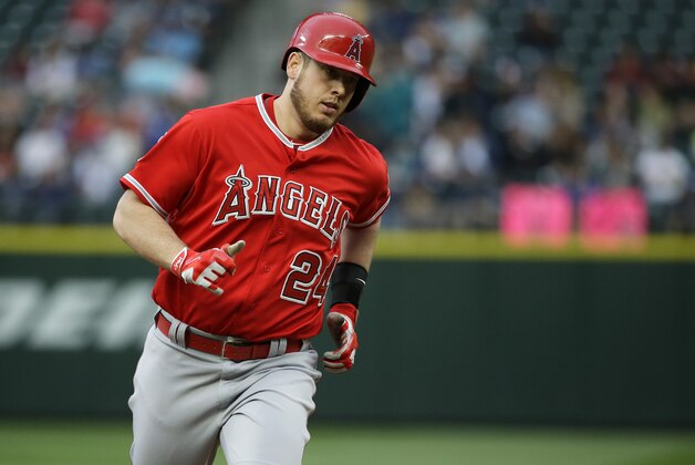 Los Angeles Angels' C.J. Cron rounds the bases after hitting a home run against the Seattle Mariners during the fourth inning of a baseball game, Friday, July 10, 2015, in Seattle. (AP Photo/Ted S. Warren)