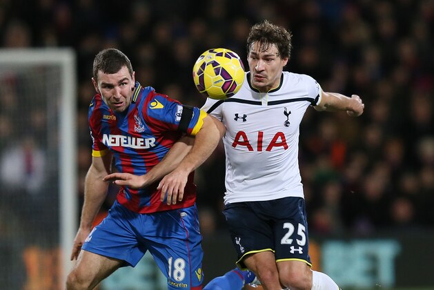 Crystal Palace's James McArthur, left, tussles with Tottenham Hotspur’s Benjamin Stambouli during the English Premier League soccer match between Crystal Palace and Tottenham Hotspur at Selhurst Park, London, England, Saturday, Jan. 10, 2015. (AP Photo/Tim Ireland)