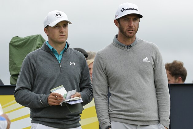 United States’ Jordan Spieth, left, and United States’ Dustin Johnson speak before playing from the 15th tee during the first round of the British Open Golf Championship at the Old Course, St. Andrews, Scotland, Thursday, July 16, 2015. (AP Photo/David J. Phillip)