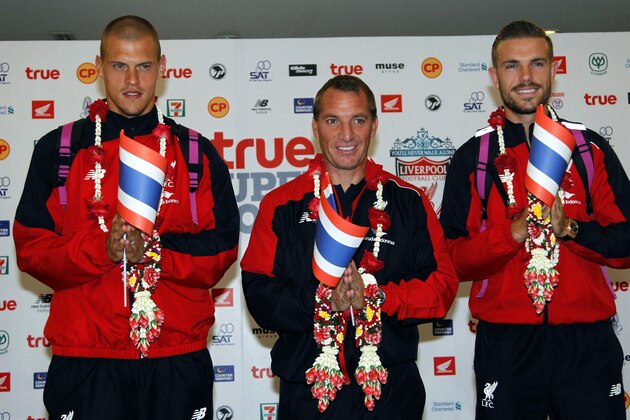 Liverpool's Martin Skrtel, left, Brendan Rodgers, center, and Jordan Henderson, right, pose in the Thai traditional Liverpool's Martin Skrtel, left, Brendan Rodgers, center, and Jordan Henderson, right, pose in the Thai traditional