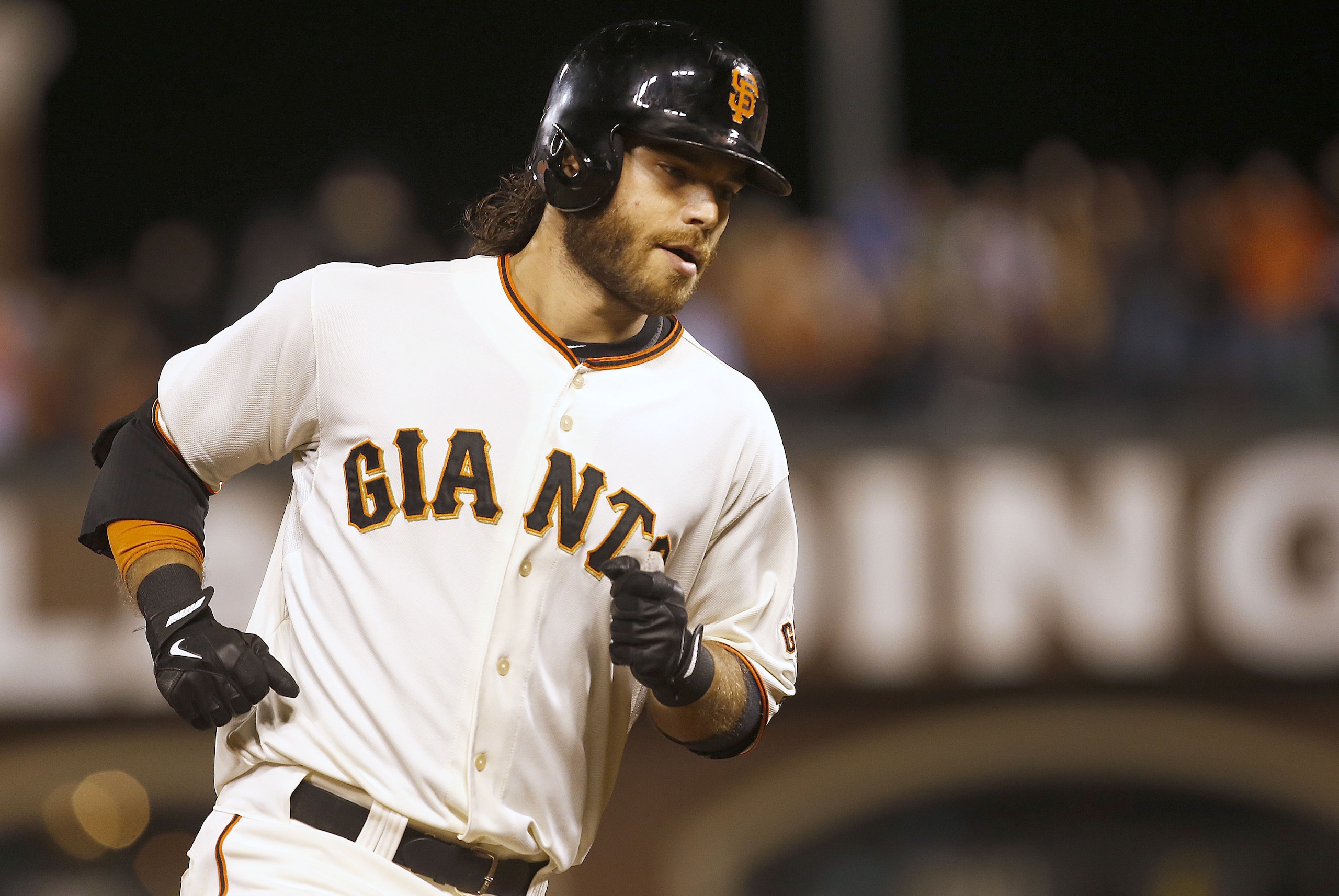 San Francisco Giants' Brandon Crawford rounds the bases after hitting a solo home run against San Diego Padres during the fourth nning of a baseball game in San Francisco, Thursday, Sept. 25, 2014. (AP Photo/Tony Avelar)