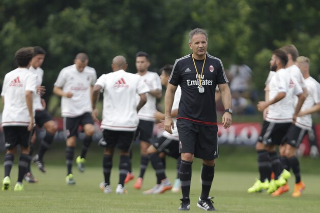 AC Milan coach Sinisa Mihajlovic, walks on the pitch during a training session at the Milanello center in Carnago, near Milan, Italy, Friday, July 3, 2015. AC Milan president Silvio Berlusconi has demanded new coach Sinisa Mihajlovic lead the club back into the Champions League. (AP Photo/Luca Bruno) AC Milan coach Sinisa Mihajlovic, walks on the pitch during a training session at the Milanello center in Carnago, near Milan, Italy, Friday, July 3, 2015. AC Milan president Silvio Berlusconi has demanded new coach Sinisa Mihajlovic lead the club back into the Champions League. (AP Photo/Luca Bruno)