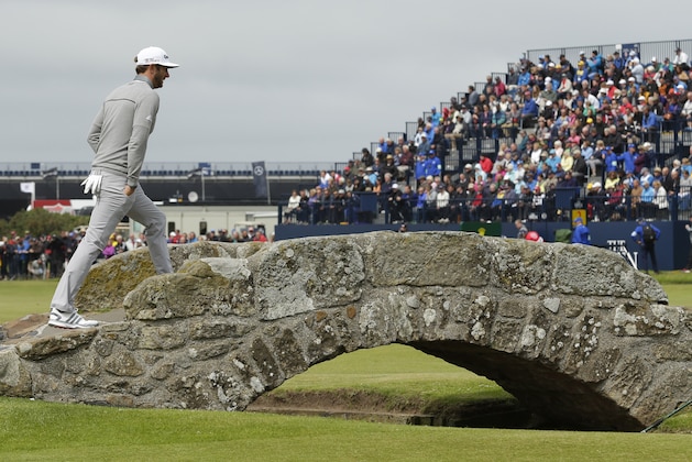 United States’ Dustin Johnson crosses Swilcan Bridge on hole 18 during the first round of the British Open Golf Championship at the Old Course, St. Andrews, Scotland, Thursday, July 16, 2015. (AP Photo/David J. Phillip)