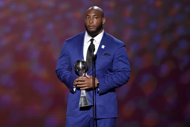 NFL player Devon Still, of the Cincinnati Bengals, accepts the Jimmy V award for perserverance at the ESPY Awards at the Microsoft Theater on Wednesday, July 15, 2015, in Los Angeles. (Photo by Chris Pizzello/Invision/AP)