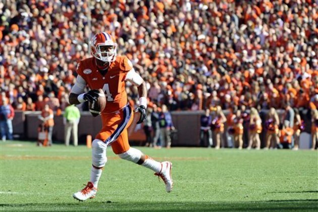Clemson quarterback Deshaun Watson (4) looks to pass against South Carolina during the first half of an NCAA college football game, Saturday, Nov. 29, 2014, in Clemson, S.C. (AP Photo/Rainier Ehrhardt)