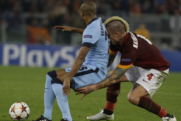Roma's Radja Nainggolan and Manchester City's Fernandinho, left, vie for the ball during their Champions League, Group E soccer match at Rome's Olympic Stadium, Wednesday, Dec. 10, 2014. (AP Photo/Gregorio Borgia) Roma's Radja Nainggolan and Manchester City's Fernandinho, left, vie for the ball during their Champions League, Group E soccer match at Rome's Olympic Stadium, Wednesday, Dec. 10, 2014. (AP Photo/Gregorio Borgia)
