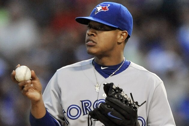 Toronto Blue Jays starter Marcus Stroman reacts after giving up five runs during the first inning of a baseball game against the Chicago White Sox in Chicago, Friday, Aug. 15, 2014. (AP Photo/Paul Beaty)