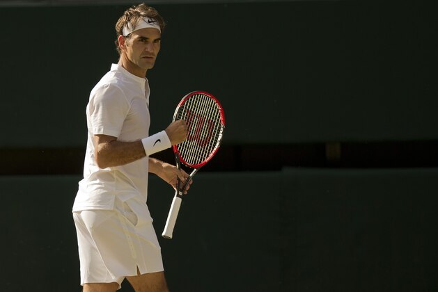 Jul 10, 2015; United Kingdom; Roger Federer (SUI) reacts during his match against Andy Murray (GBR) on day 11 of The Championships Wimbledon at the AELTC. Mandatory Credit: Susan Mullane-USA TODAY Sports