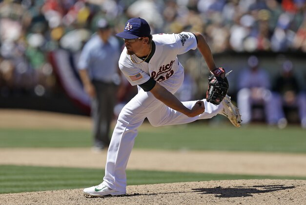 Oakland Athletics' Tyler Clippard reacts as the final out is made against the Seattle Mariners at the end of a baseball game Saturday, July 4, 2015, in Oakland, Calif. The Athletics won, 2-0. (AP Photo/Ben Margot)