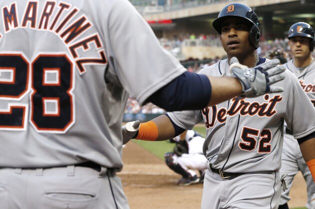 Detroit Tigers’ Yoenis Cespedes, right, is congratulated by J.D. Martinez after his three-run home run off Minnesota Twins pitcher Ervin Santana in the fourth inning of a baseball game, Friday, July 10, 2015, in Minneapolis. J.D. Martinez had a solo home run shortly after in the inning. (AP Photo/Jim Mone)