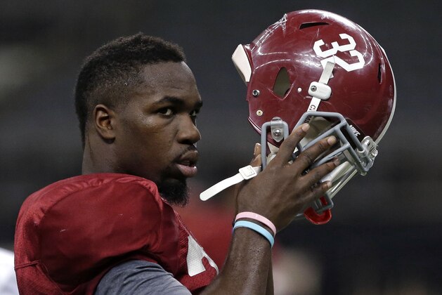 Alabama linebacker C.J. Mosley (32) puts on his helmet during NCAA college football practice at the Superdome in New Orleans, Saturday, Dec. 28, 2013.  Alabama takes on Oklahoma in the Sugar Bowl on Thursday, Jan. 2, 2014. (AP Photo/Gerald Herbert)