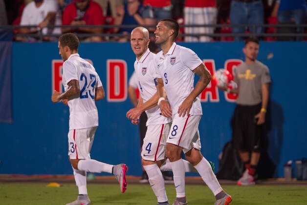 Jul 7, 2015; Dallas, TX, USA; United States defender Fabian Johnson (23) and midfielder Michael Bradley (4) and forward Clint Dempsey (8) celebrate a goal against Honduras during the 2015 Gold Cup soccer match at Toyota Stadium. United States defeats Honduras 2-1. Mandatory Credit: Jerome Miron-USA TODAY Sports