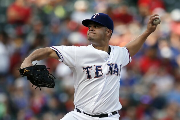Texas Rangers starting pitcher Wandy Rodriguez works against the San Diego Padres during the first inning of a baseball game Friday, July 10, 2015, in Arlington, Texas. (AP Photo/Tony Gutierrez)