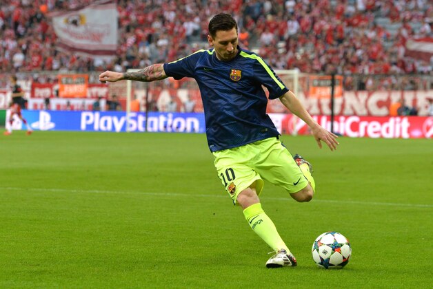 Barcelona's Lionel Messi warms up for the soccer Champions League second leg semifinal match between Bayern Munich and FC Barcelona at Allianz Arena in Munich, southern Germany, Tuesday, May 12, 2015. (AP Photo/Kerstin Joensson)
