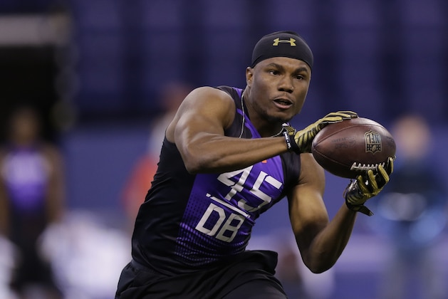 Florida Atlantic defensive back D'Joun Smith runs a drill at the NFL football scouting combine in Indianapolis, Monday, Feb. 23, 2015. (AP Photo/Julio Cortez)