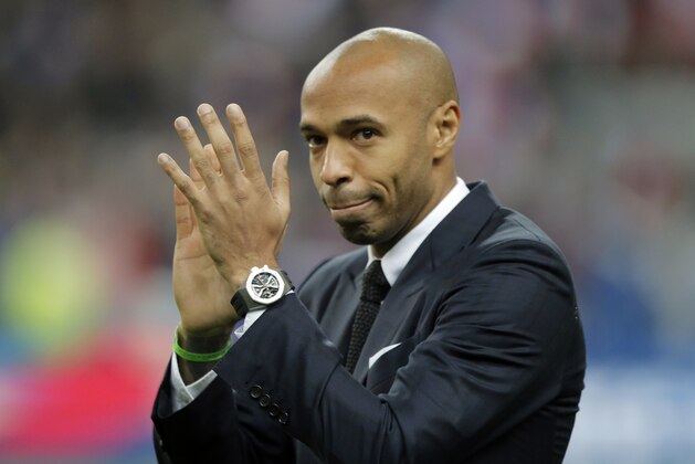 Former France's soccer player Thierry Henry acknowledges applause prior to the international friendly soccer match between France and Brazil at the Stade de France, north of Paris, France, Thursday, March 26, 2015. (AP Photo/Francois Mori)
