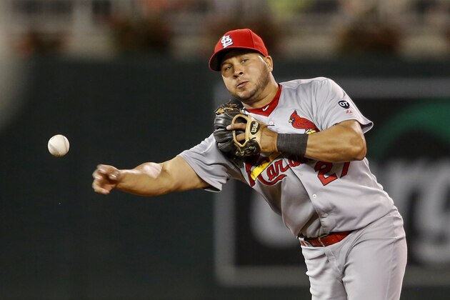 St. Louis Cardinals shortstop Jhonny Peralta throws to first after fielding a ball hit by the Minnesota Twins in the eighth inning of a baseball game Wednesday, June 17, 2015, in Minneapolis. Originally ruled an out, a replay challenge reversed the call and the play was an RBI hit. (AP Photo/Bruce Kluckhohn)