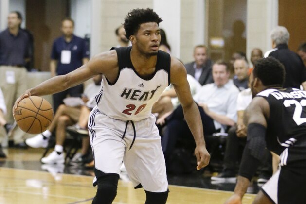 Miami Heat's Justise Winslow (20) moves the ball against the Los Angeles Clippers during the first half of an NBA summer league basketball game, Wednesday, July 8, 2015, in Orlando, Fla. (AP Photo/John Raoux)