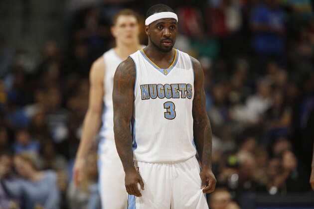 Denver Nuggets guard Ty Lawson looks on against the Sacramento Kings in the third quarter of the Kings' 110-105 victory in an NBA basketball game in Denver on Monday, Nov. 3, 2014. (AP Photo/David Zalubowski)