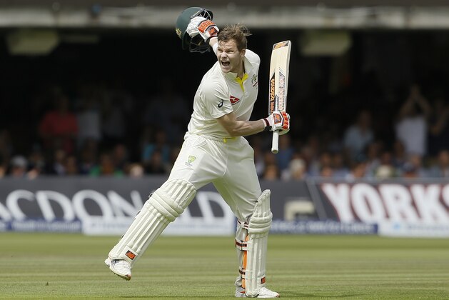Australia's Steven Smith celebrates getting 200 runs on the second day of the second Ashes Test match between England and Australia, at Lord's cricket ground in London, Friday, July 17, 2015. (AP Photo/Kirsty Wigglesworth)