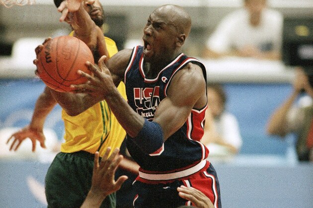 USA's Michael Jordan takes the ball to the hoop past the out stretched arms of Brazil's Josuel Aristides Santos for two points during first half action of their game at the XXV Summer Olympic Games in Barcelona, Friday, July 31, 1992. USA won the game 127-83. (AP Photo/Stephan Sevoia)