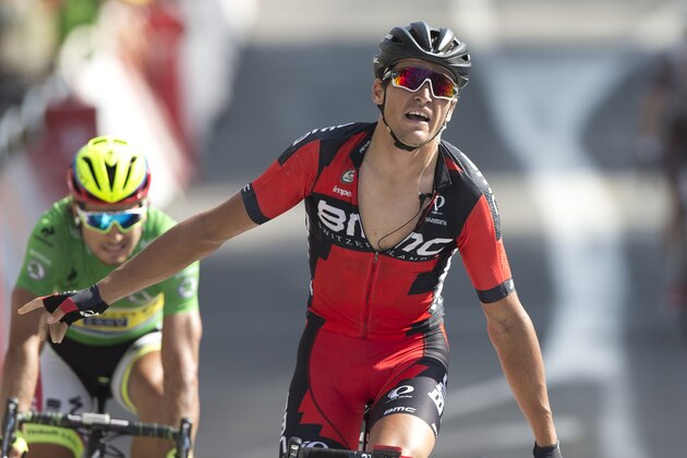 Belgium's Greg van Avermaet celebrates crosses the finish line ahead of Peter Sagan of Slovakia, wearing the best sprinter's green jersey, to win the thirteenth stage of the Tour de France cycling race over 198.5 kilometers (123.3 miles) with start in Muret and finish in Rodez, France, Friday, July 17, 2015. (AP Photo/Peter Dejong)