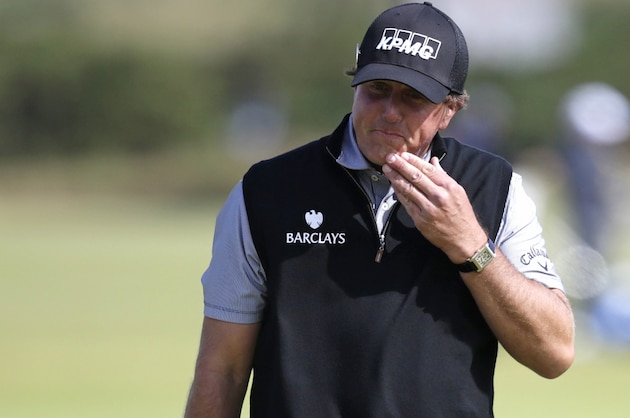 United States’ Phil Mickelson reacts as he drops two shots on the 11th green during the second round of the British Open Golf Championship at the Old Course, St. Andrews, Scotland, Friday, July 17, 2015. (AP Photo/Alastair Grant)