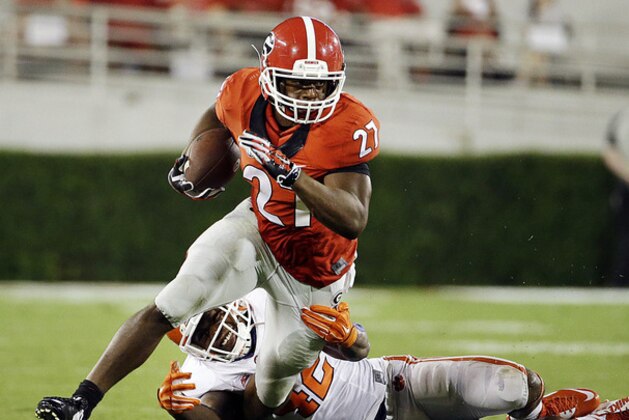 Georgia's Nick Chubb, left, breaks free from the tackle of Clemson's Stephone Anthony to run for a touchdown in the second half of an NCAA college football game, Saturday, Aug. 30, 2014, in Athens, Ga. (AP Photo/David Goldman)