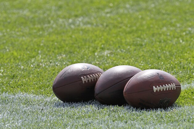 Footballs are lined up on the field during Minnesota Vikings  NFL football rookie minicamp in Eden Prairie, Minn., Friday, May 8, 2015. The Vikings got all 10 of the rookies from the class of 2015 signed to contracts before the first minicamp opened on Friday. (AP Photo/Ann Heisenfelt)