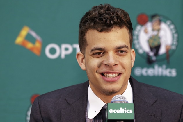 Boston Celtics 2015 draft pick R.J. Hunter smiles as he listen's to a reporter's question after his  introduction to members of the media at the Boston Celtics basketball team's training facility Tuesday, June 30, 2015, in Waltham, Mass. (AP Photo/Stephan Savoia)