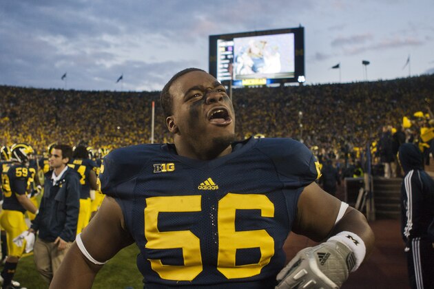 Michigan defensive tackle Ondre Pipkins (56) pumps up the crowd from the sidelines in the fourth quarter of an NCAA college football game against Michigan State, Saturday, Oct. 20, 2012, in Ann Arbor, Mich. Michigan won 12-10. (AP Photo/Tony Ding)