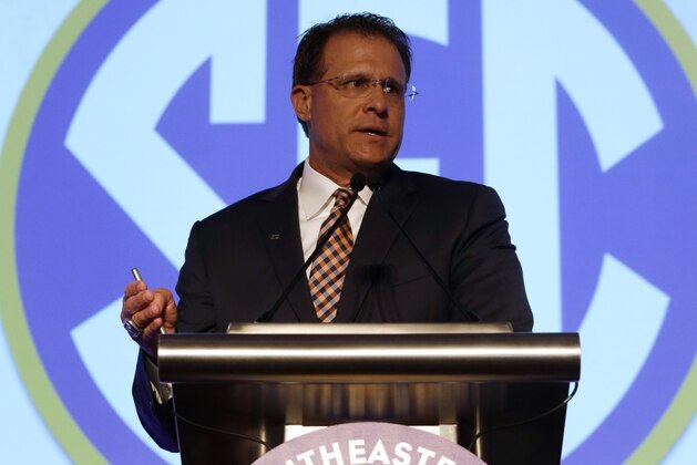 Auburn coach Gus Malzahn speaks to the media during the NCAA college football Southeastern Conference Media Days, Monday, July 13, 2015, in Hoover, Ala. (AP Photo/Butch Dill)