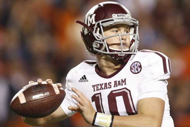 Texas A&M quarterback Kyle Allen (10) sets back to throw the ball against Auburn during the second half of an NCAA college football game Saturday, Nov. 8, 2014, in Auburn, Ala. Texas A&M defeated Auburn 41-38. (AP Photo/Brynn Anderson)