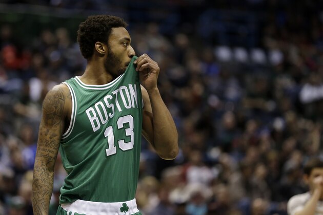 Boston Celtics' James Young wipes his face during an NBA basketball game against the Milwaukee Bucks Wednesday, April 15, 2015, in Milwaukee. (AP Photo/Aaron Gash)
