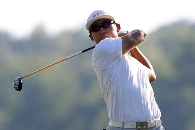 Whee Kim, of South Korea, watches his tee shot on the ninth hole during the second round of the Barbasol Championship golf tournament, Friday, July 17, 2015, in Opelika, Ala. (AP Photo/Butch Dill)