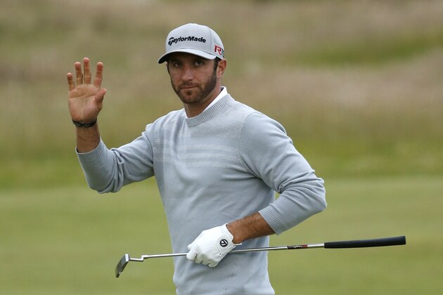 United States’ Dustin Johnson waves after making a putt on the 10th green during the second round of the British Open Golf Championship at the Old Course, St. Andrews, Scotland, Friday, July 17, 2015. (AP Photo/Jon Super)