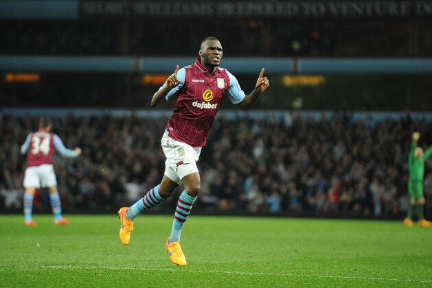 Villa's Christian Benteke celebrates after scoring his third goal against QPR during the English Premier League soccer match between Aston Villa and Queens Park Rangers at Villa Park, Birmingham, England, Tuesday, April 7, 2015. (AP Photo/Rui Vieira)