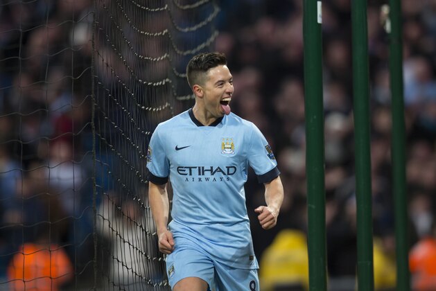 Manchester City's Samir Nasri celebrates after scoring  during the English Premier League soccer match between Manchester City and Newcastle at the Etihad Stadium, Manchester, England, Saturday Feb. 21, 2015. (AP Photo/Jon Super)