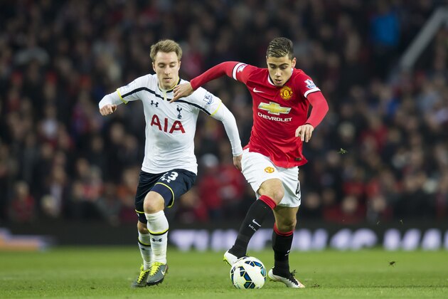 Manchester United's Andreas Pereira, right, fights for the ball against Tottenham Hotspur's Christian Eriksen during the English Premier League soccer match between Manchester United and Tottenham Hotspur at Old Trafford Stadium, Manchester, England, Sunday March 15, 2015. (AP Photo/Jon Super)