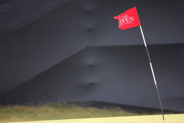 A pin marker sways in the wind on the 12th green after high winds forced a suspension in play of the second round of the British Open Golf Championship at the Old Course, St. Andrews, Scotland, Saturday, July 18, 2015. (AP Photo/Peter Morrison)