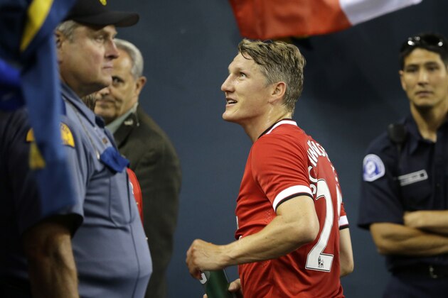 Manchester United's Bastian Schweinsteiger greets supporters after Manchester United beat Club America 1-0 in a friendly soccer match, Friday, July 17, 2015, in Seattle. (AP Photo/Ted S. Warren)
