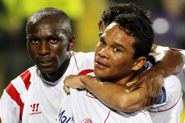 Sevilla's Carlos Bacca reacts after scoring during an  Europa League semifinal, return match, between Fiorentina and Sevilla, at the Artemio Franchi stadium in Florence, Italy, Thursday, May 14, 2015.  (AP Photo/Fabrizio Giovannozzi)