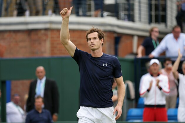 Britain's Andy Murray celebrates beating France's Jo-Wilfried Tsonga during Britain and France's quarterfinal match of the Davis Cup at the Queen's Club in London, Friday July 17, 2015. (AP Photo/Tim Ireland)