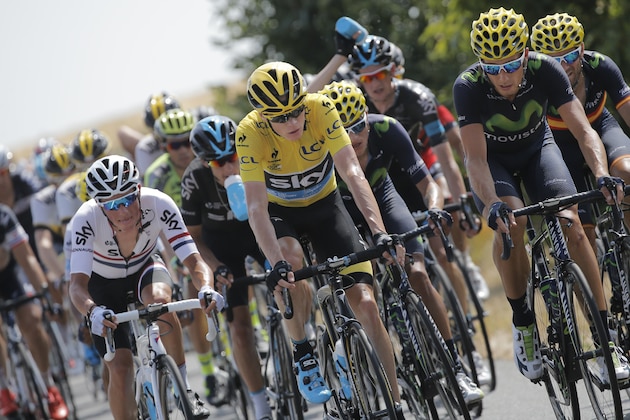 Britain's Chris Froome, wearing the overall leader's yellow jersey, rides in the pack during the thirteenth stage of the Tour de France cycling race over 198.5 kilometers (123.3 miles) with start in Muret and finish in Rodez, France, Friday, July 17, 2015. (AP Photo/Laurent Cipriani)