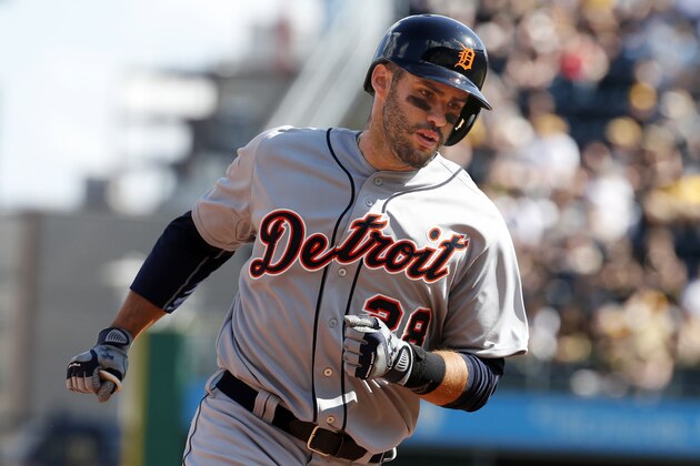 Detroit Tigers' J.D. Martinez, left, rounds third base after hitting a two-run home run off Pittsburgh Pirates closer  Mark Melancon during the ninth inning of a baseball game against the Pittsburgh Pirates in Pittsburgh Monday, April 13, 2015. The Pirates won 5-4. (AP Photo/Gene J. Puskar)