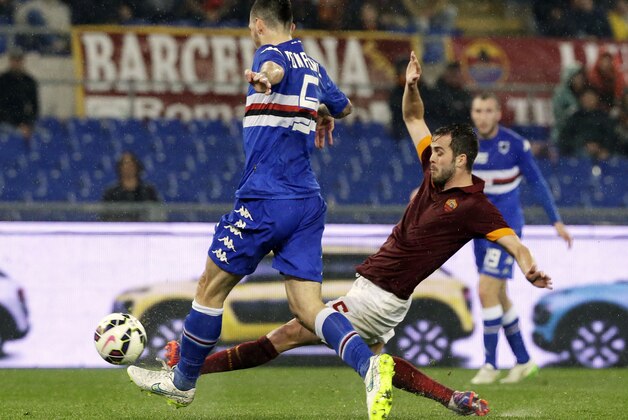 Sampdoria’s Alessio Romagnoli, left, and Roma's Miralem Pjanic fight for the ball during a Serie A soccer match between Roma and Sampdoria, at Rome's Olympic Stadium, Monday, March 16, 2015. (AP Photo/Andrew Medichini)